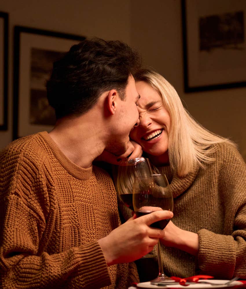 Couple laughing holding hands because he feels like a man in their marriage