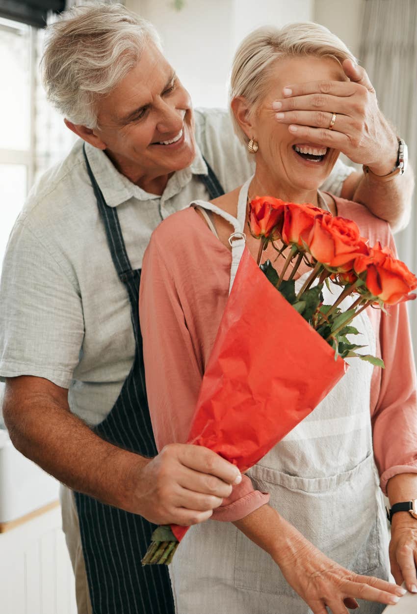 Man giving his wife flowers as a Valentine’s Day Gift 