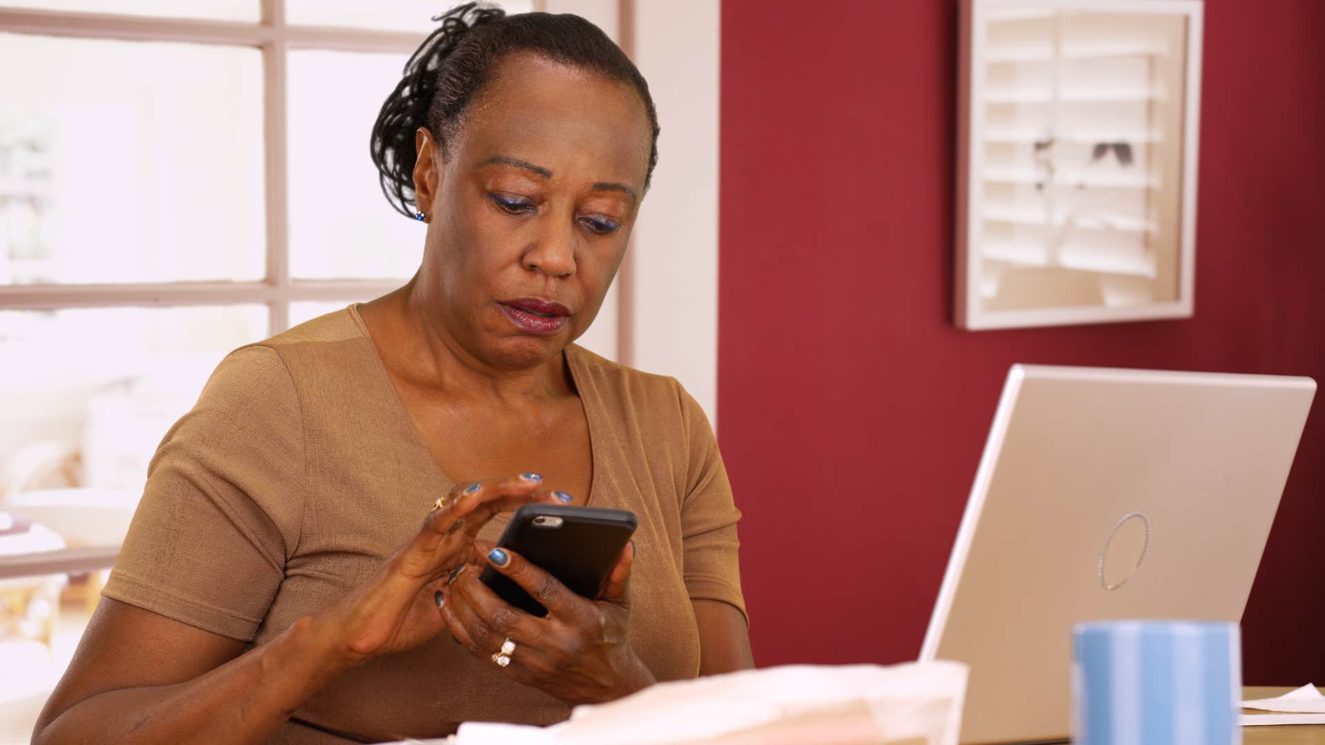 woman doing her bills at home