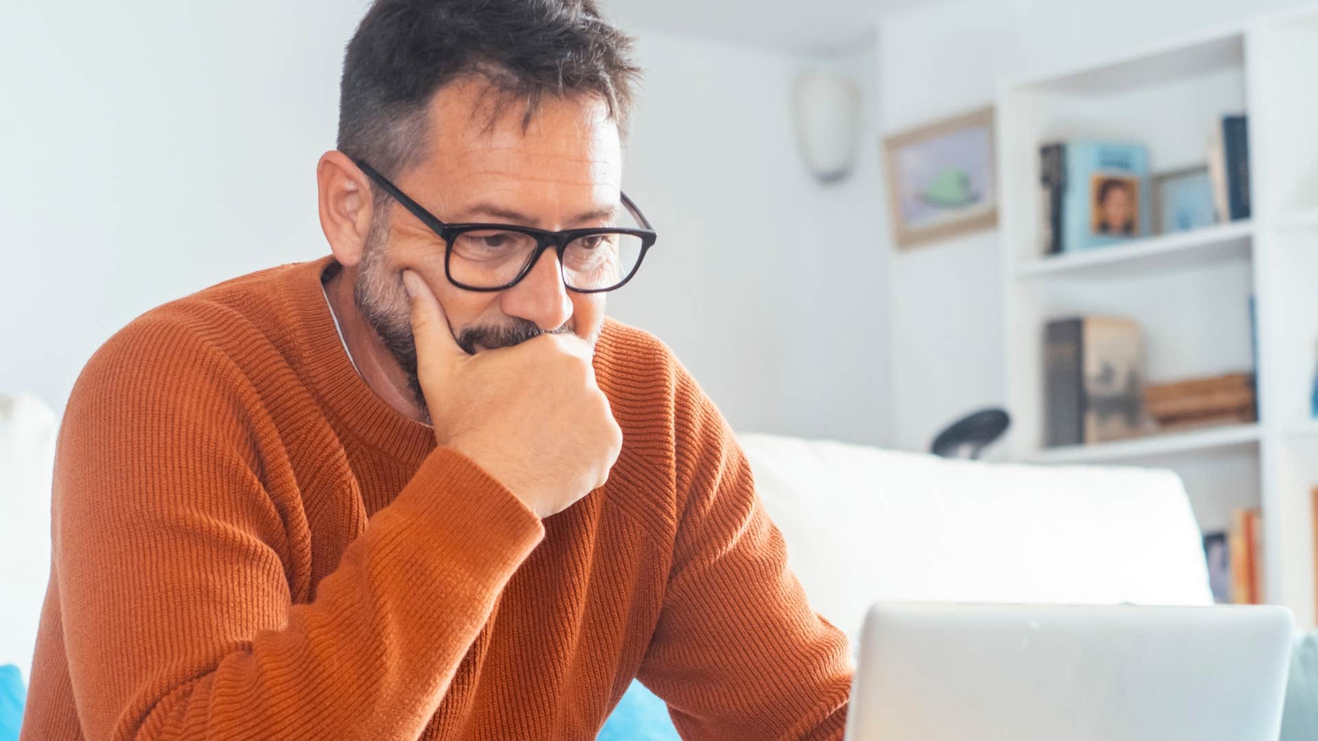 man looking at his bills online