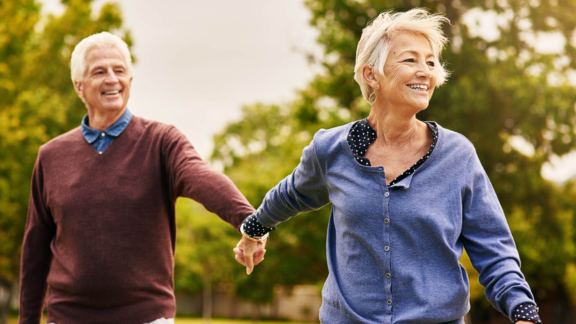 couple smiling and walking outside