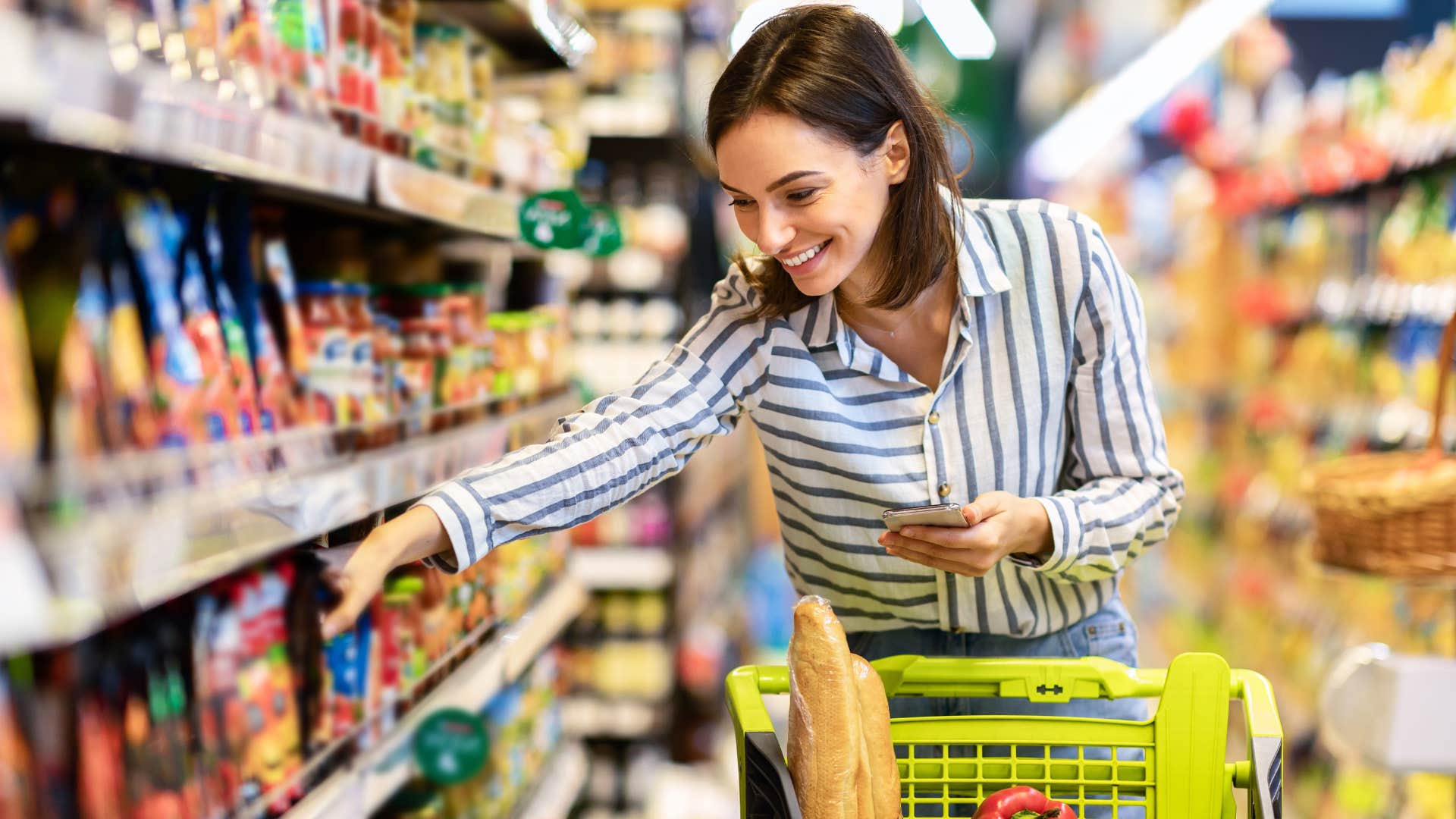 happy woman grocery shopping