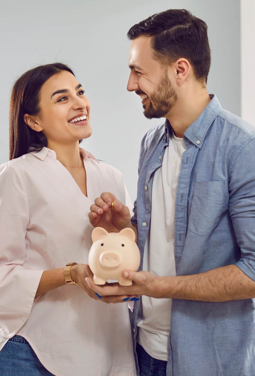 Gen Z couple considering marrying money piggybank