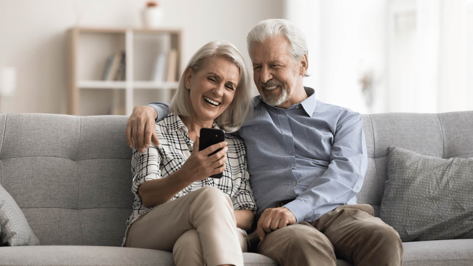 older couple sitting on couch