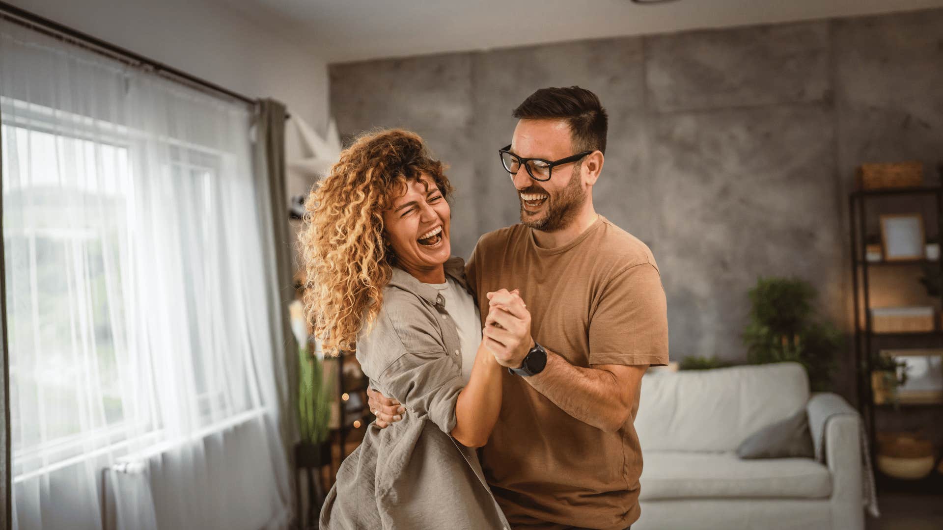 couple dancing in living room