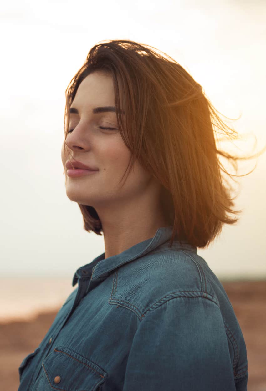 Happy woman practicing solitude 