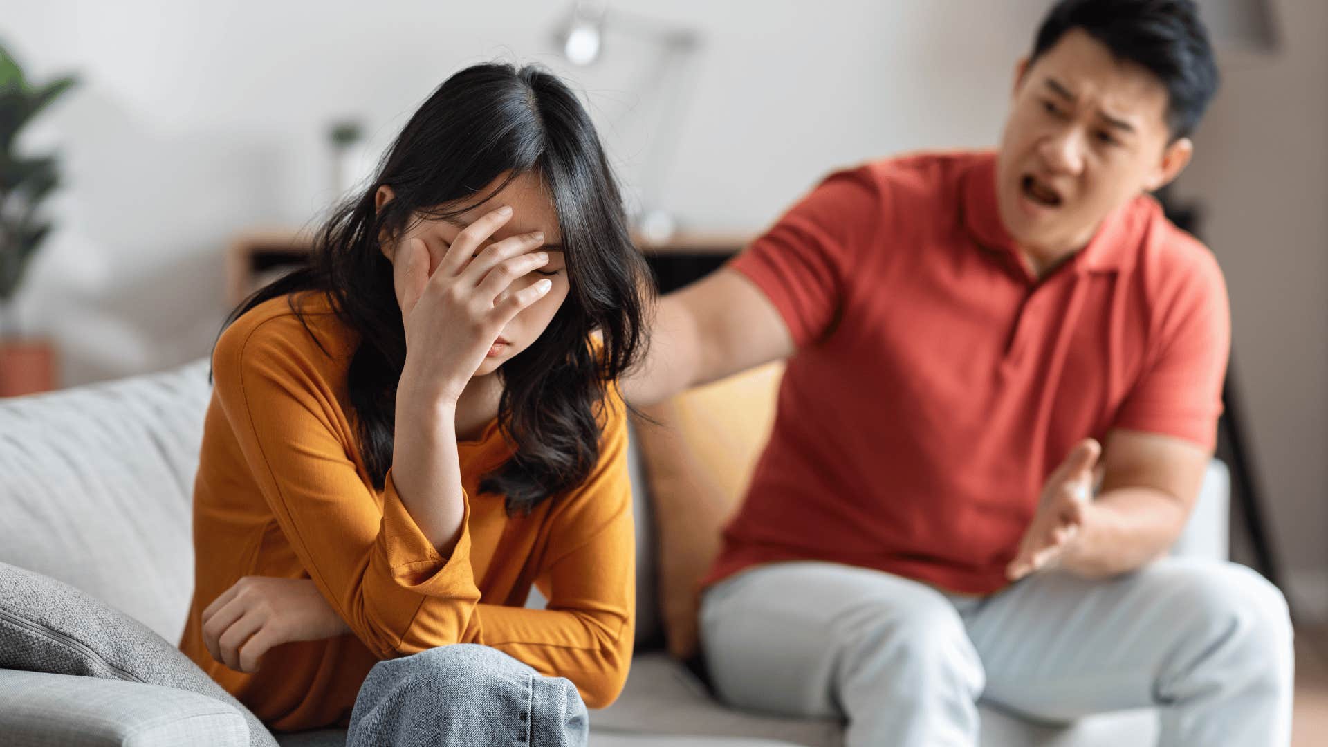 couple arguing on couch