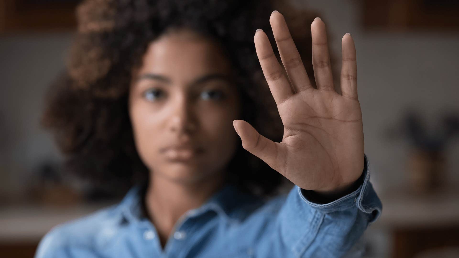 woman putting hand up