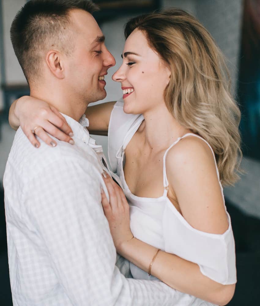 Couple in marriage hugging, he feels respected