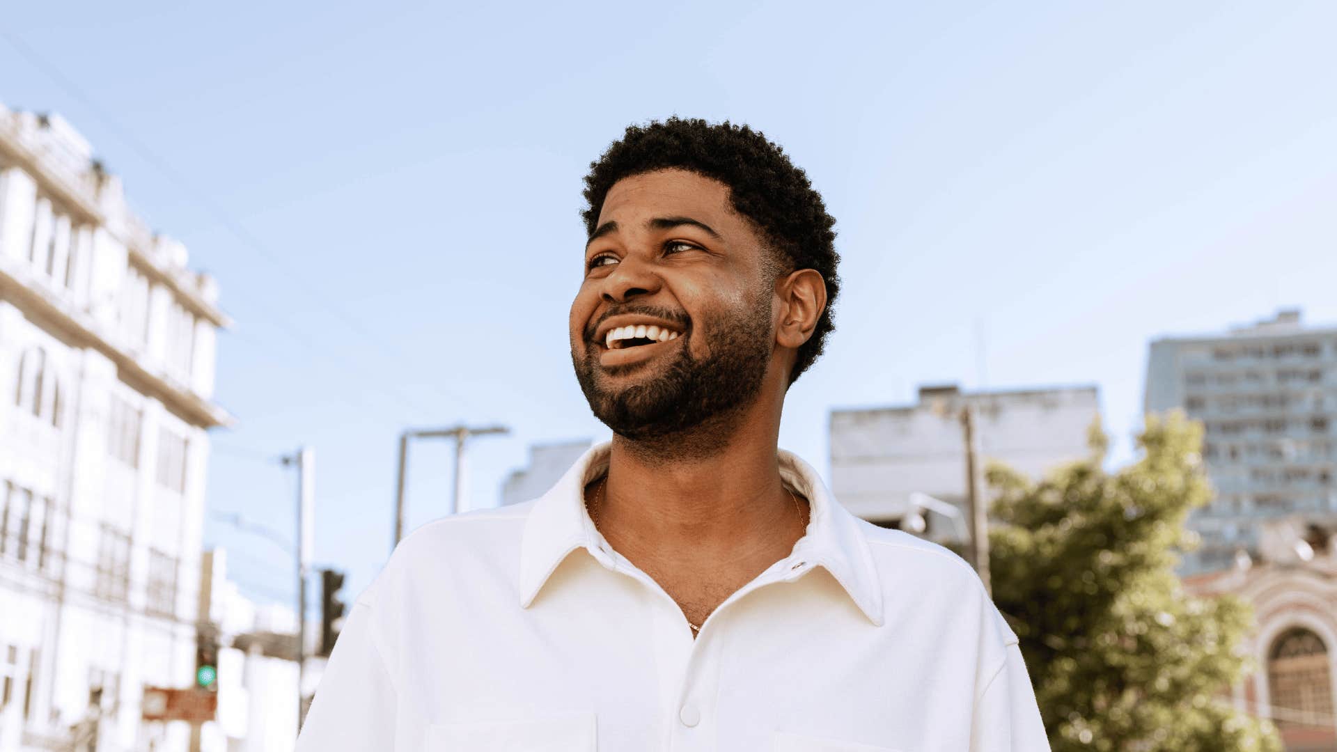 Man sees the possibilities as he smiles and looks up