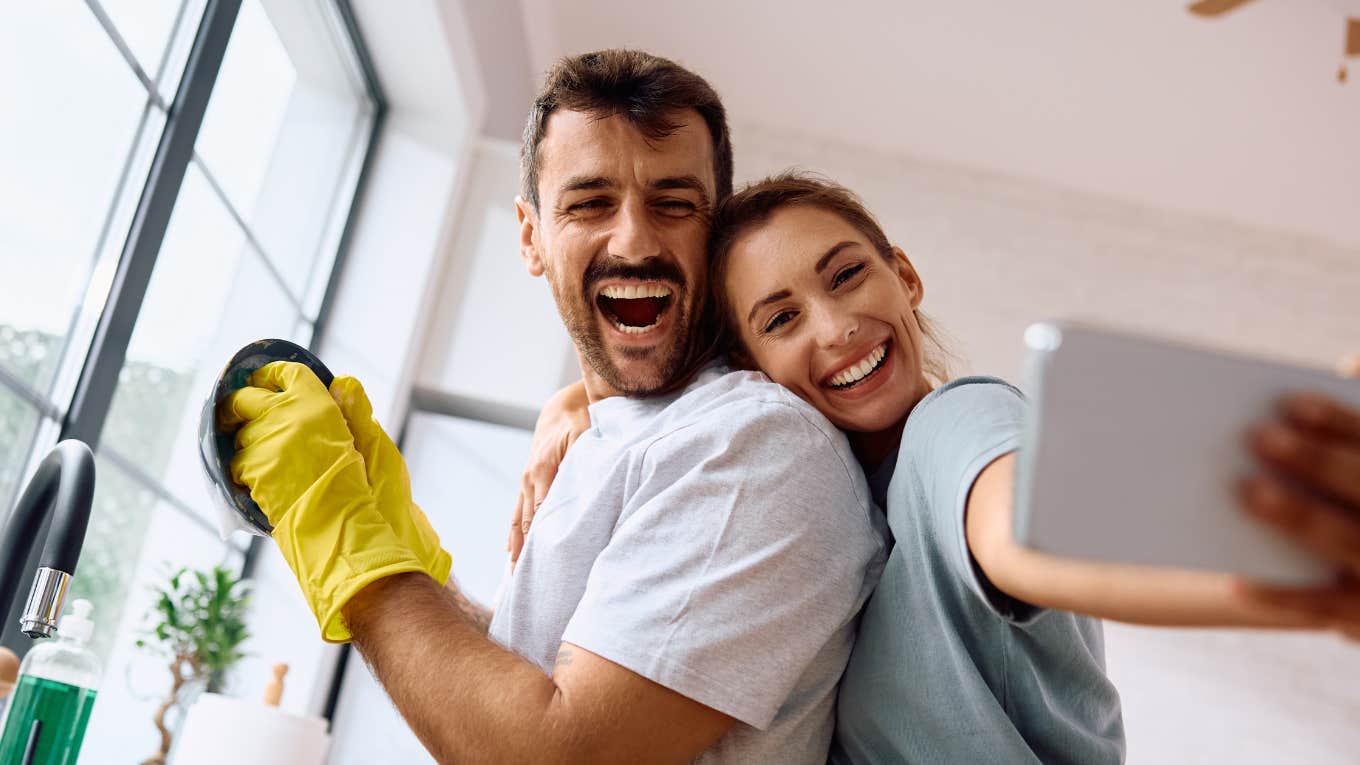 Happy couple following housework rules to stop fighitng about chores