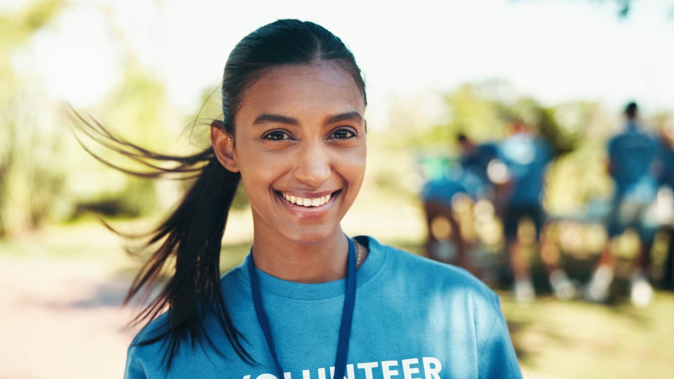 Young woman volunteer feeling calm and motivated during crisis