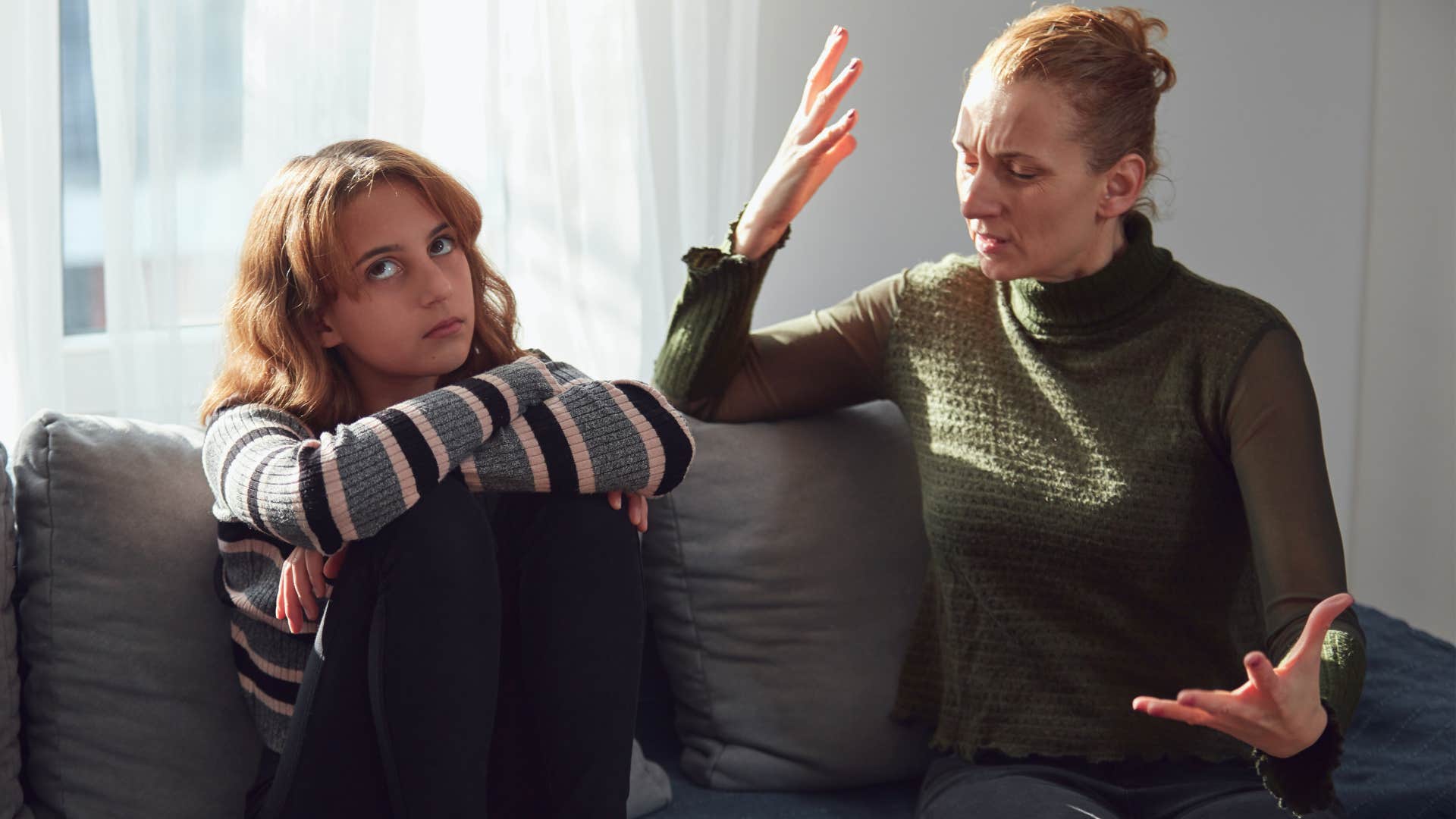 Woman arguing with her annoyed teenage daughter