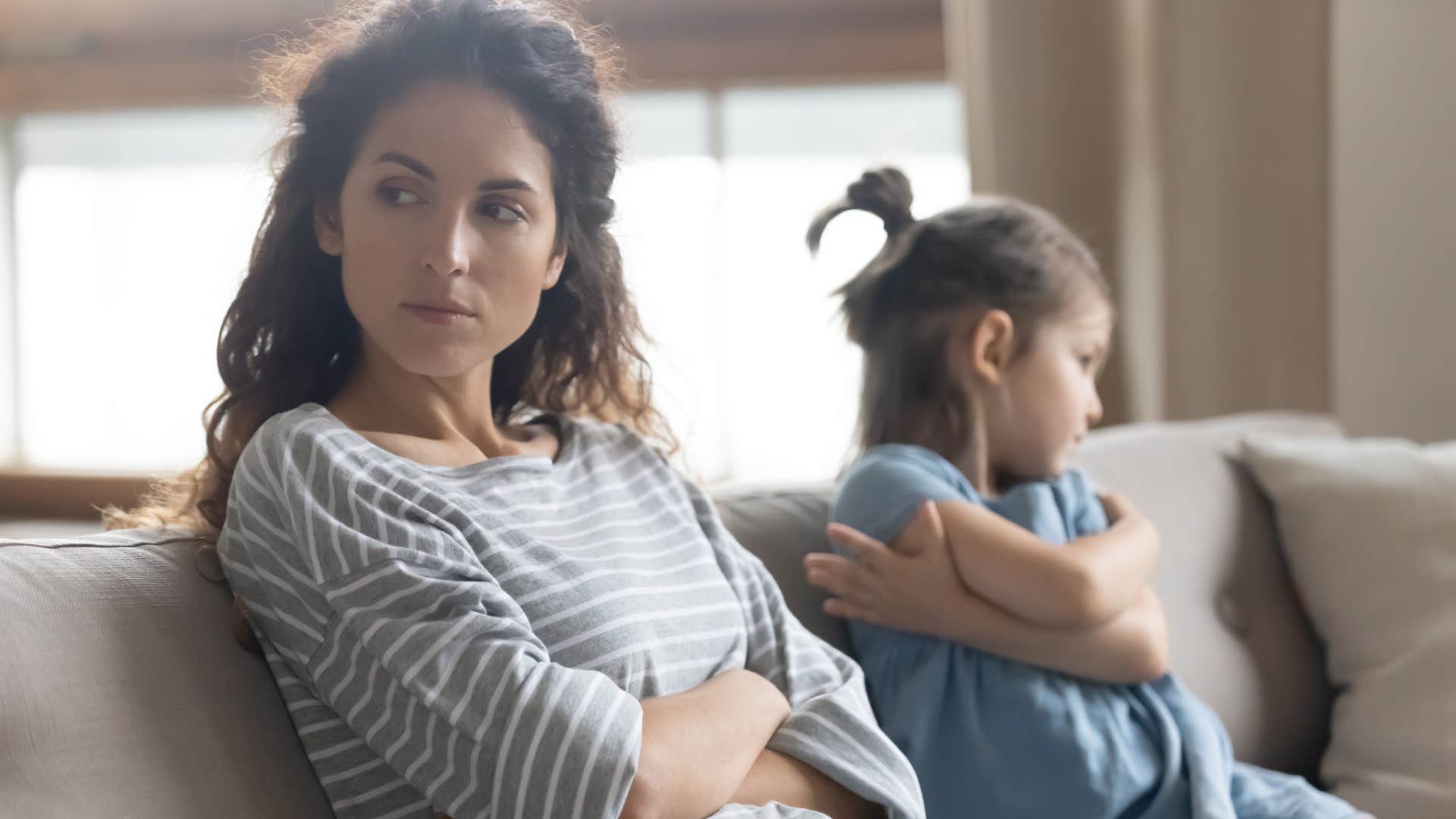 Woman turning away from her daughter