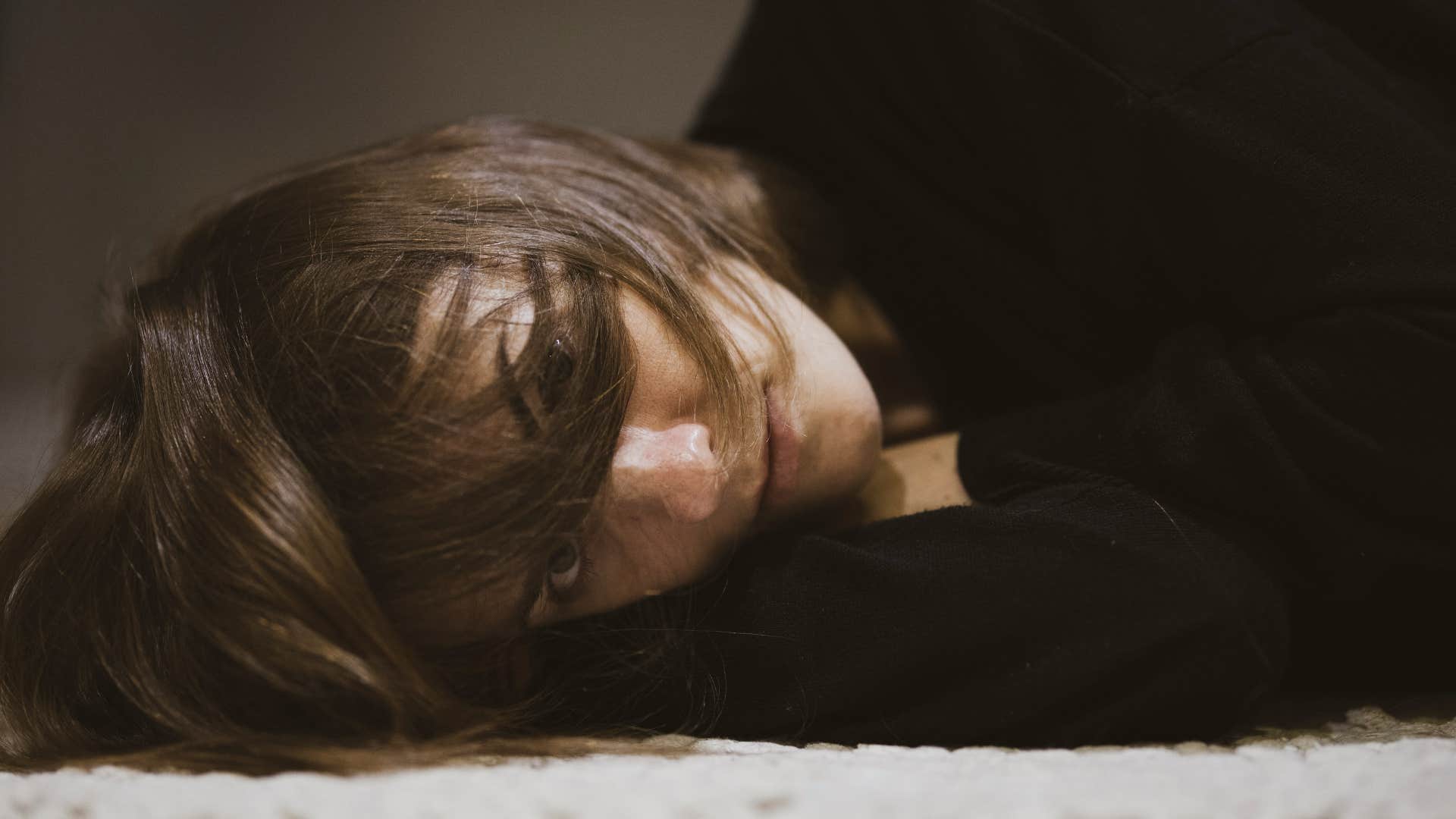 woman laying on floor