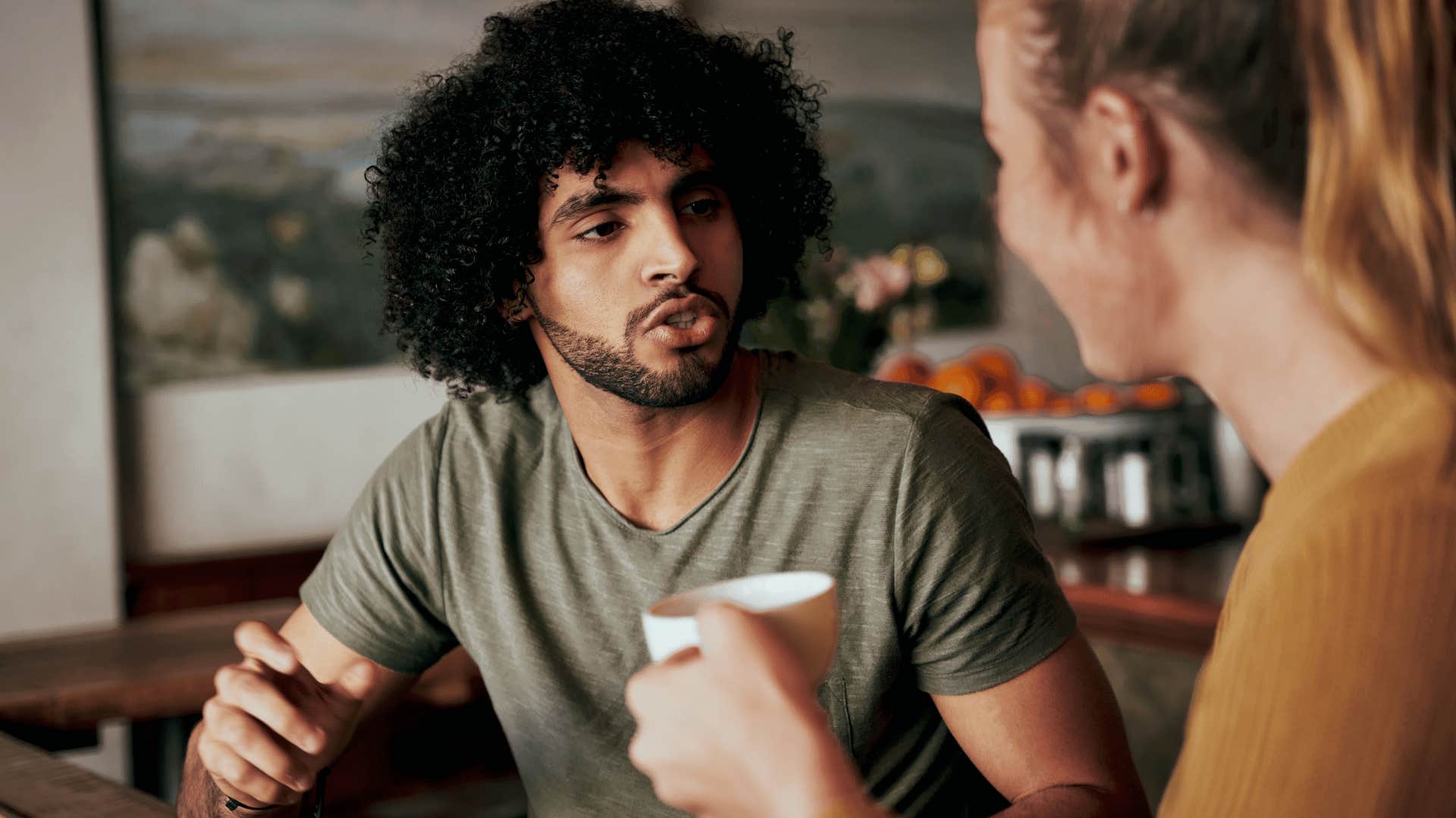 Man about to play games talking to woman