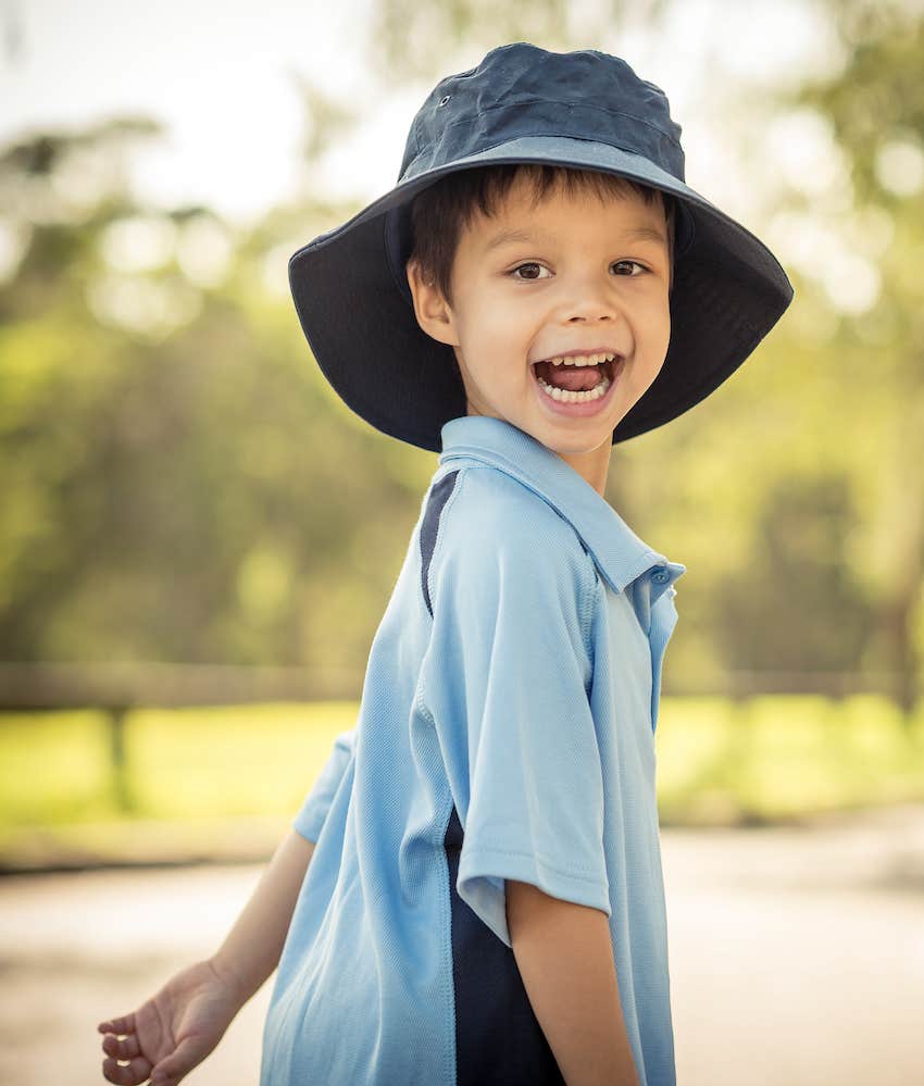 Happy child wearing oversized hat