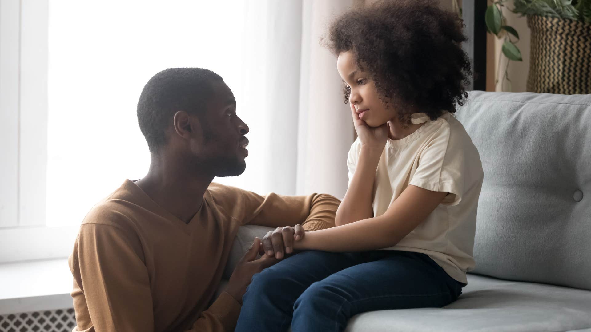 dad comforting nervous daughter