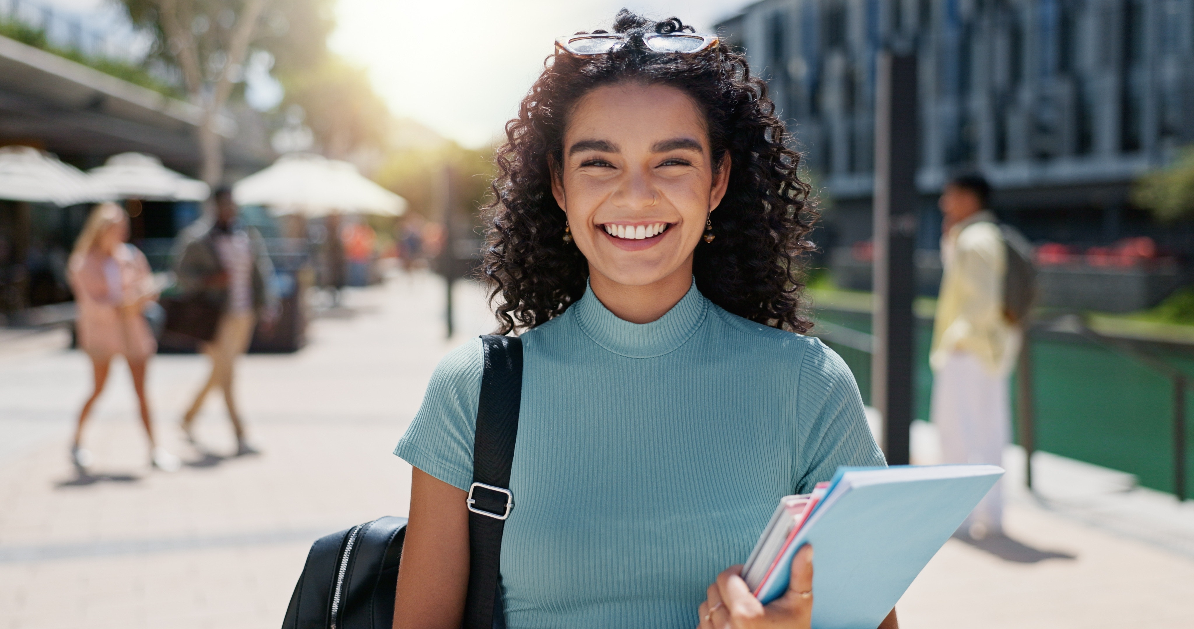 smiling woman wearing a backpack