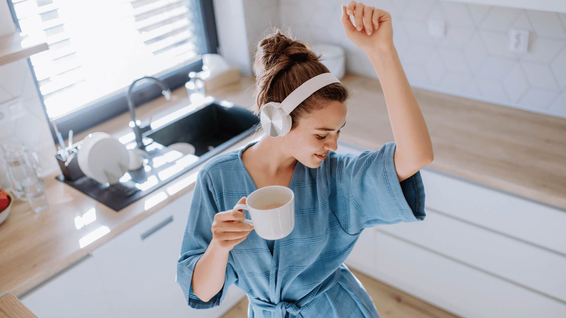 woman dancing while listening to music