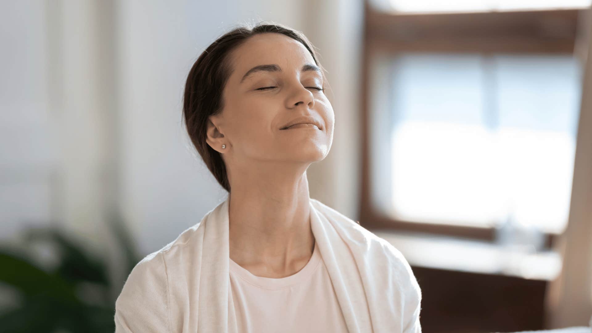 woman taking a deep breath