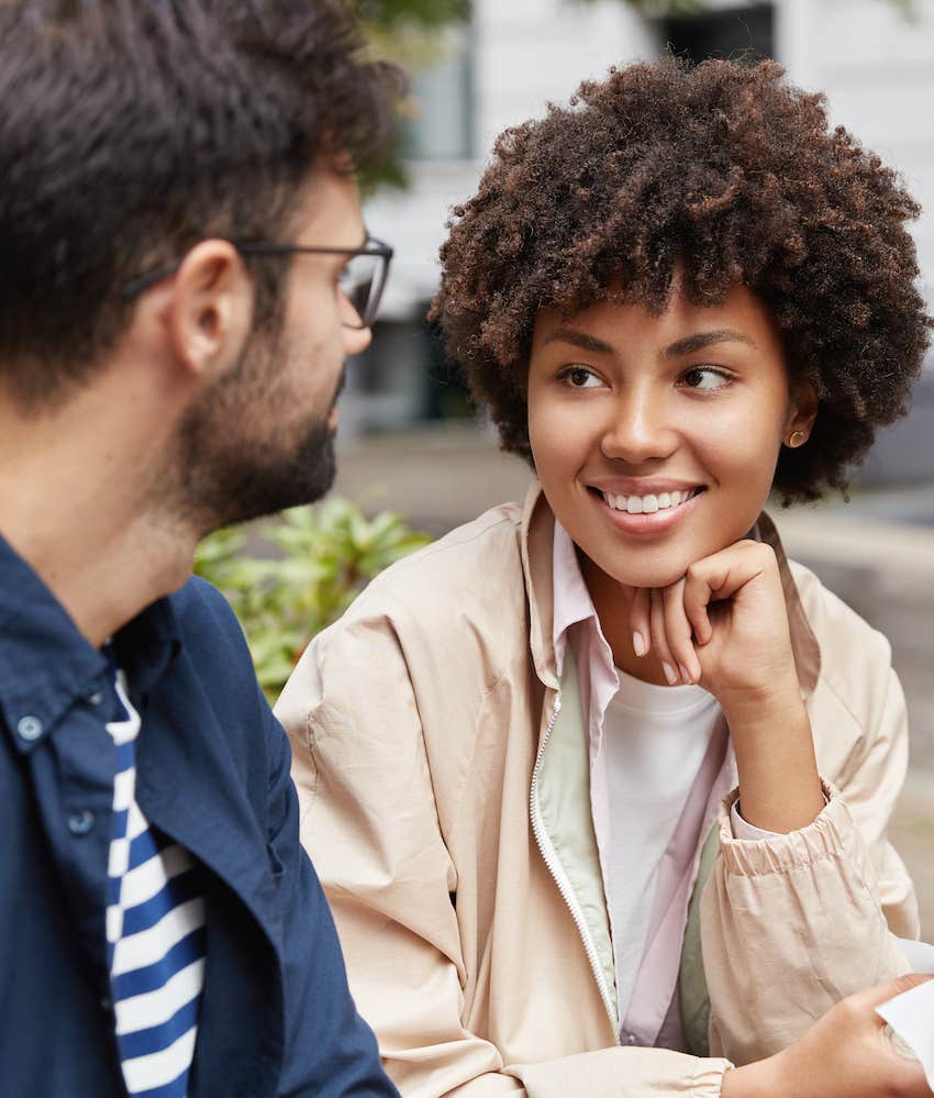 Couple sit in a park to have a deep conversation