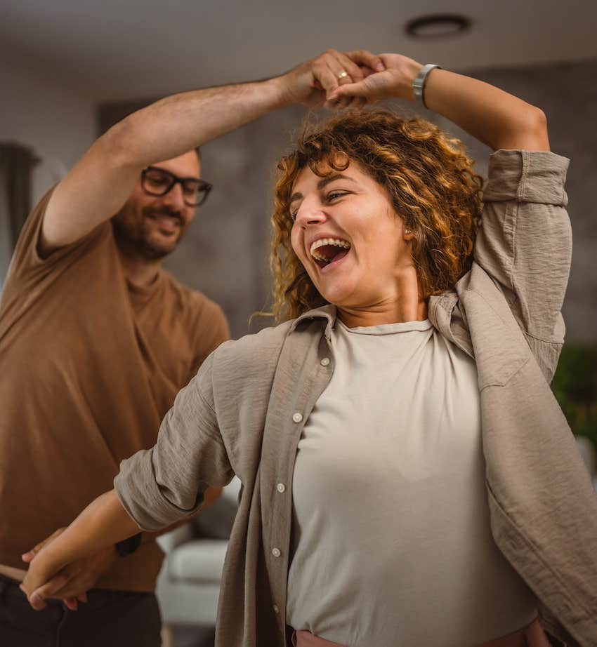 Couple dance in their living room