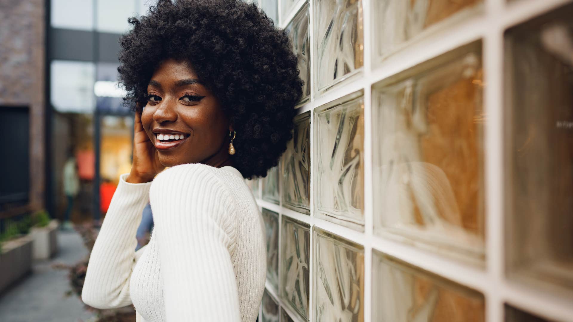 woman carrying herself with confidence to project powerful elegance and sophistication