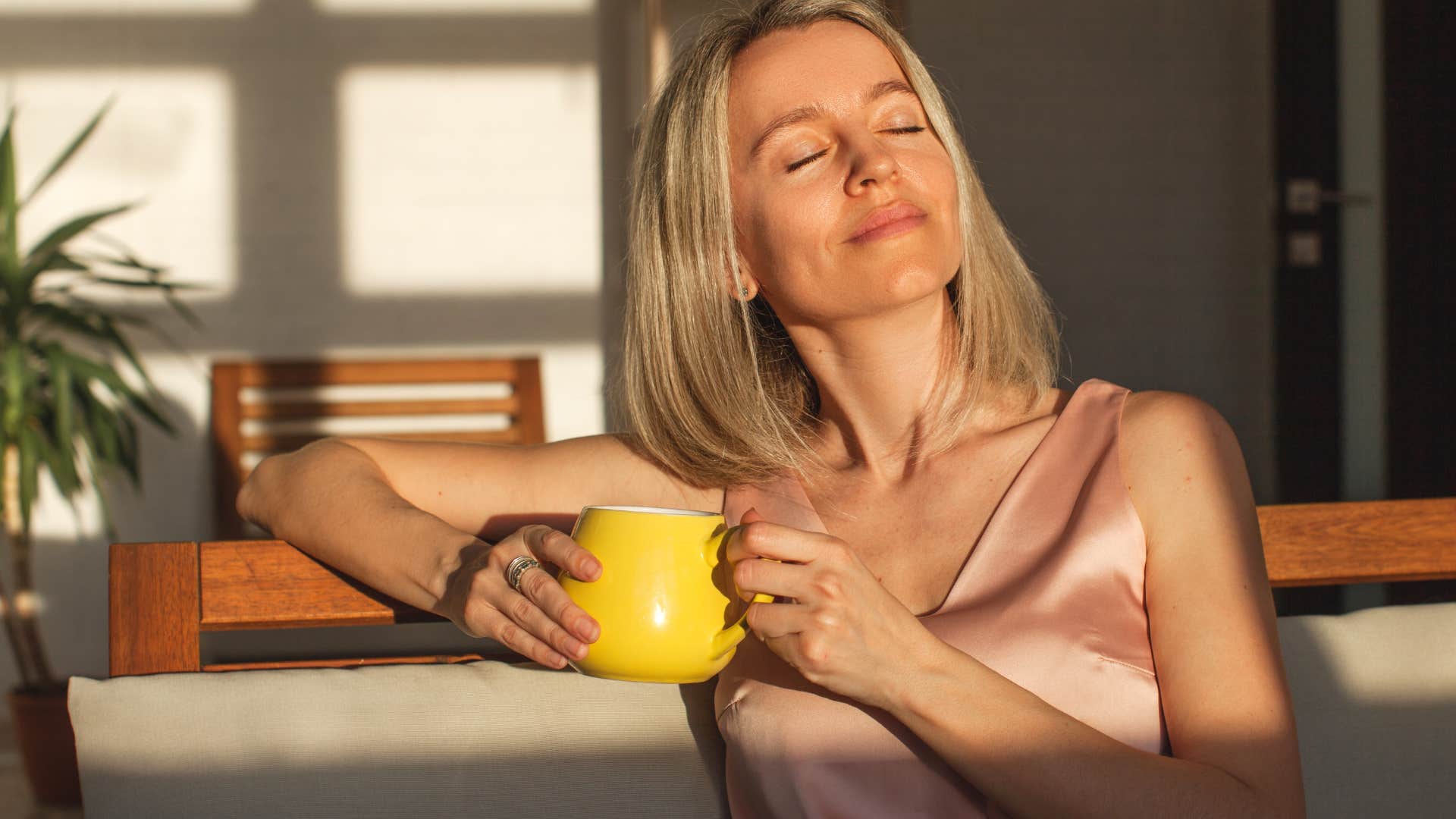 woman elevating the everyday ritual of drinking coffee to project powerful elegance and sophistication