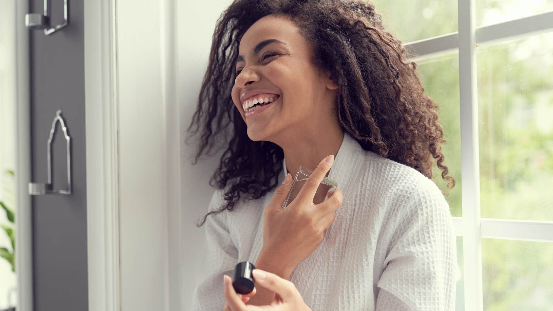 woman using her signature scent to project powerful elegance and sophistication