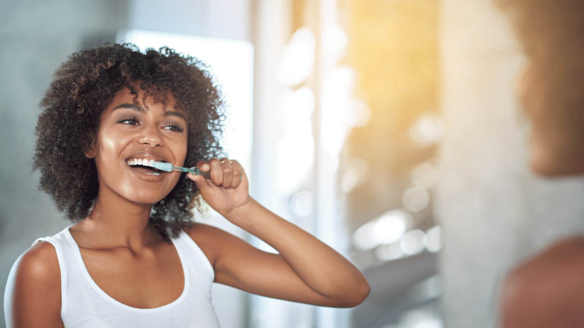 woman brushing her teeth