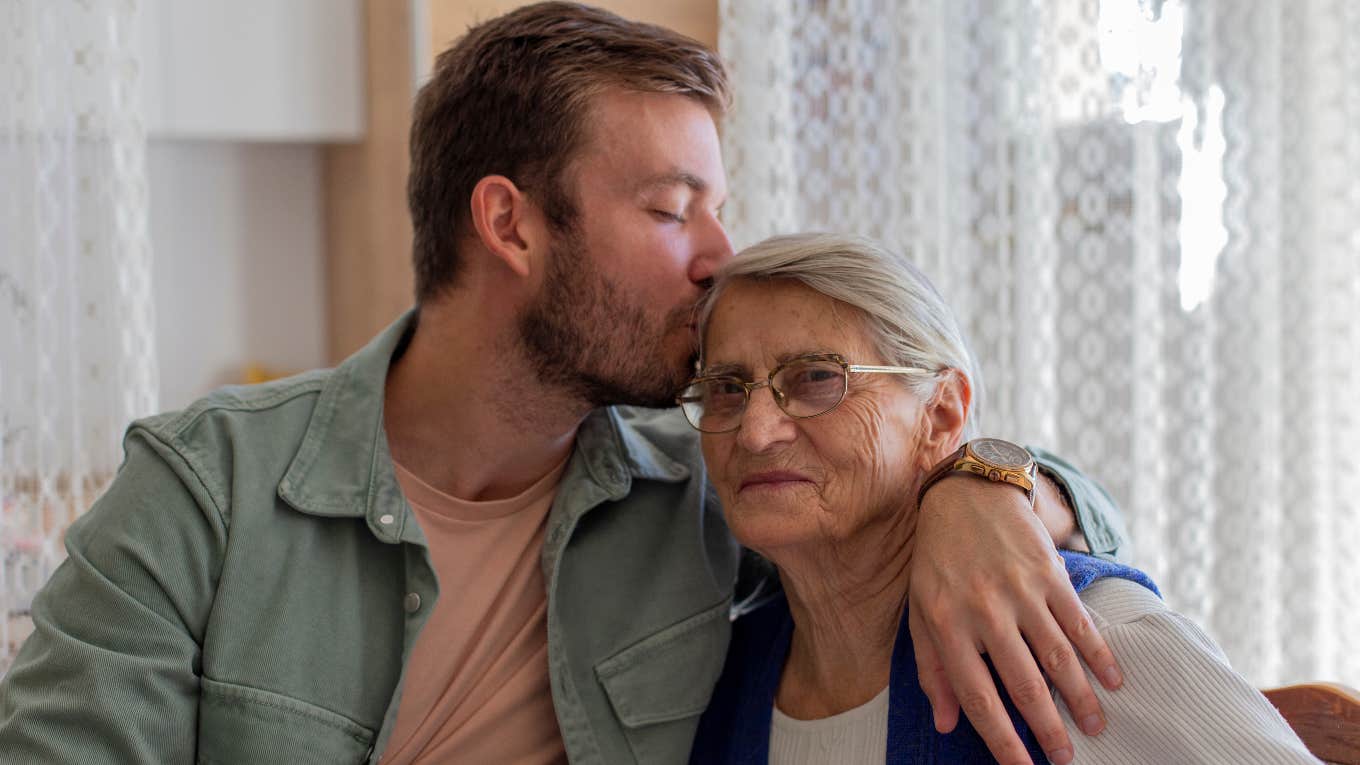 Man kissing his grandma