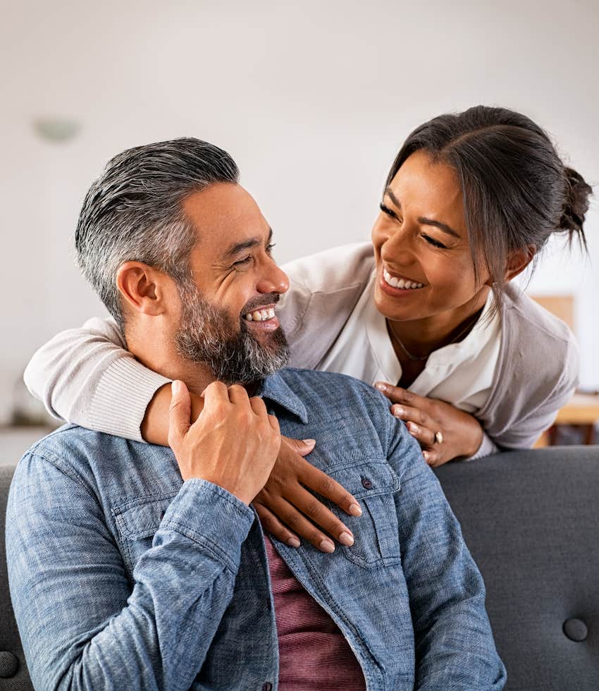 Loving couple smiles as they look into each other's eyes