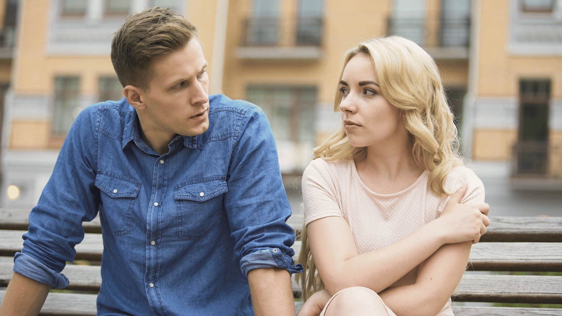 young couple sitting side by side