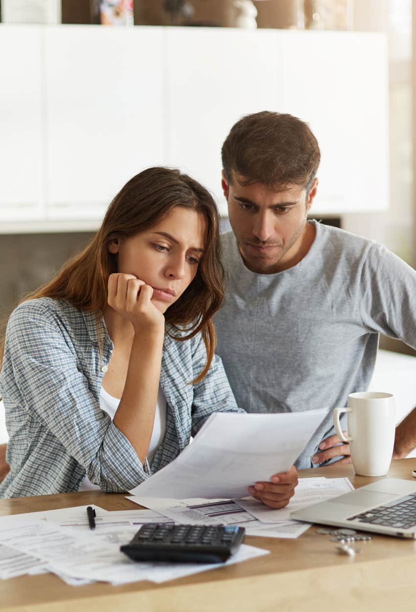 couple concerned about their finances annual income less than middle class