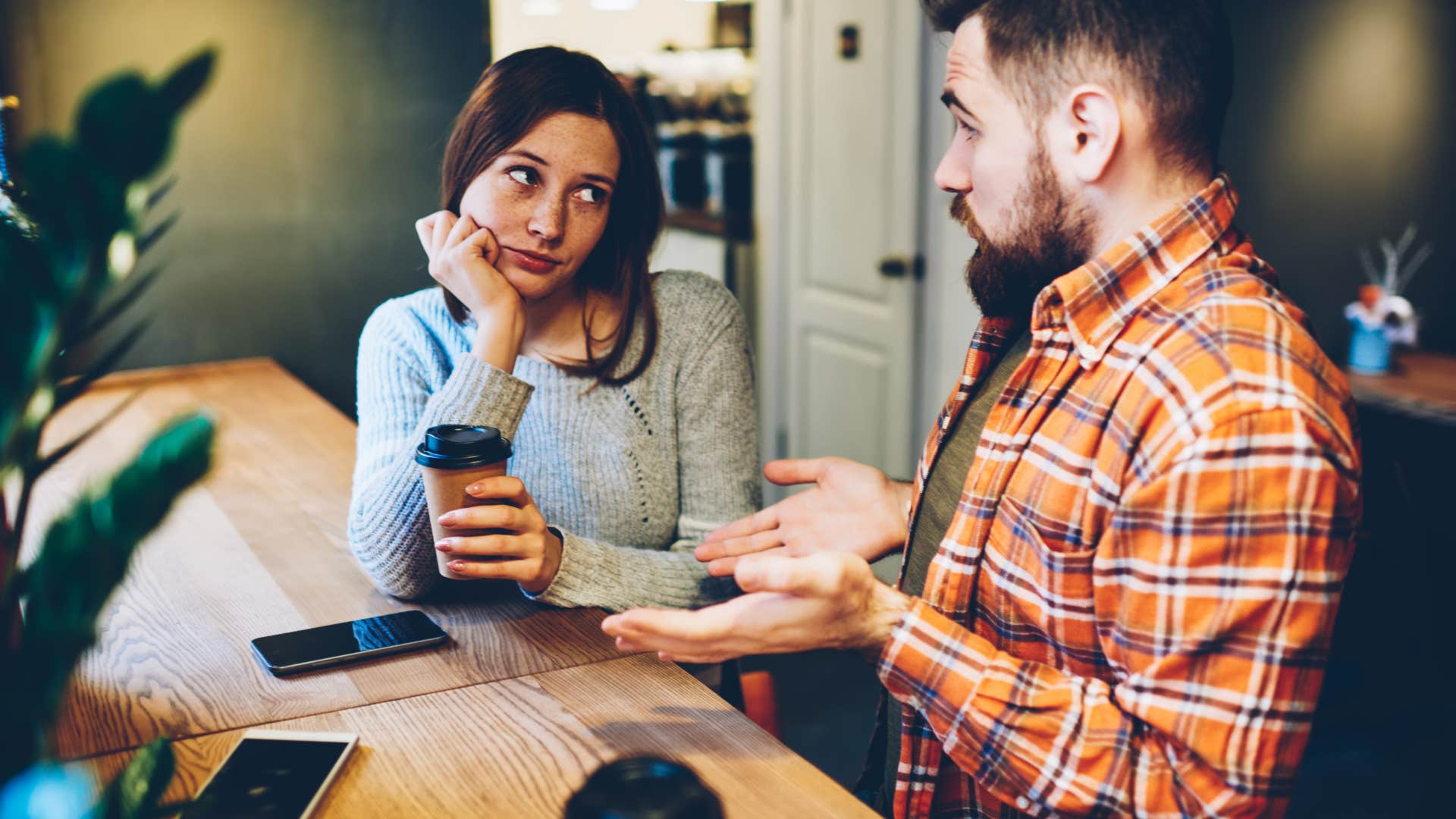 Woman, man, desk, coffee, phones