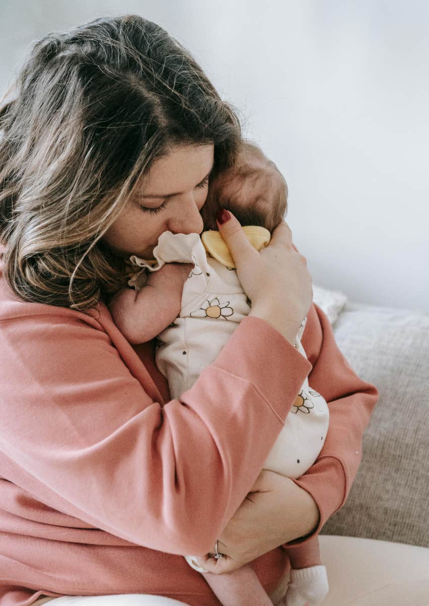 mom holding baby she wasn't able to name