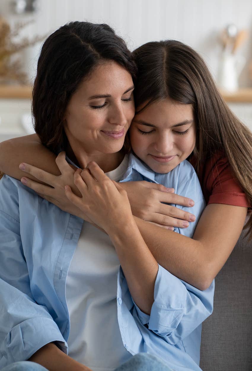 mom raising highly successful kid hugging daughter prizing happiness