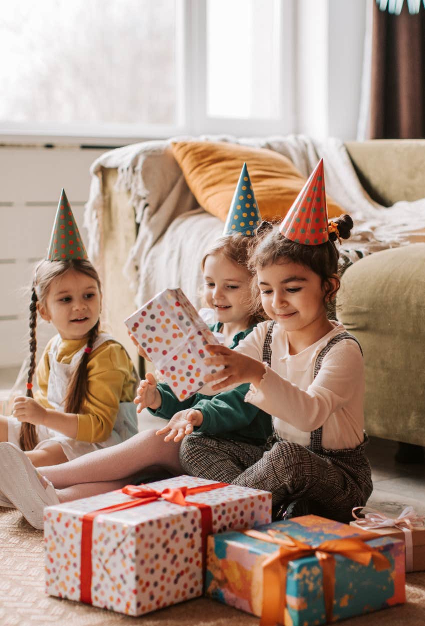 Birthday girl opening up presents