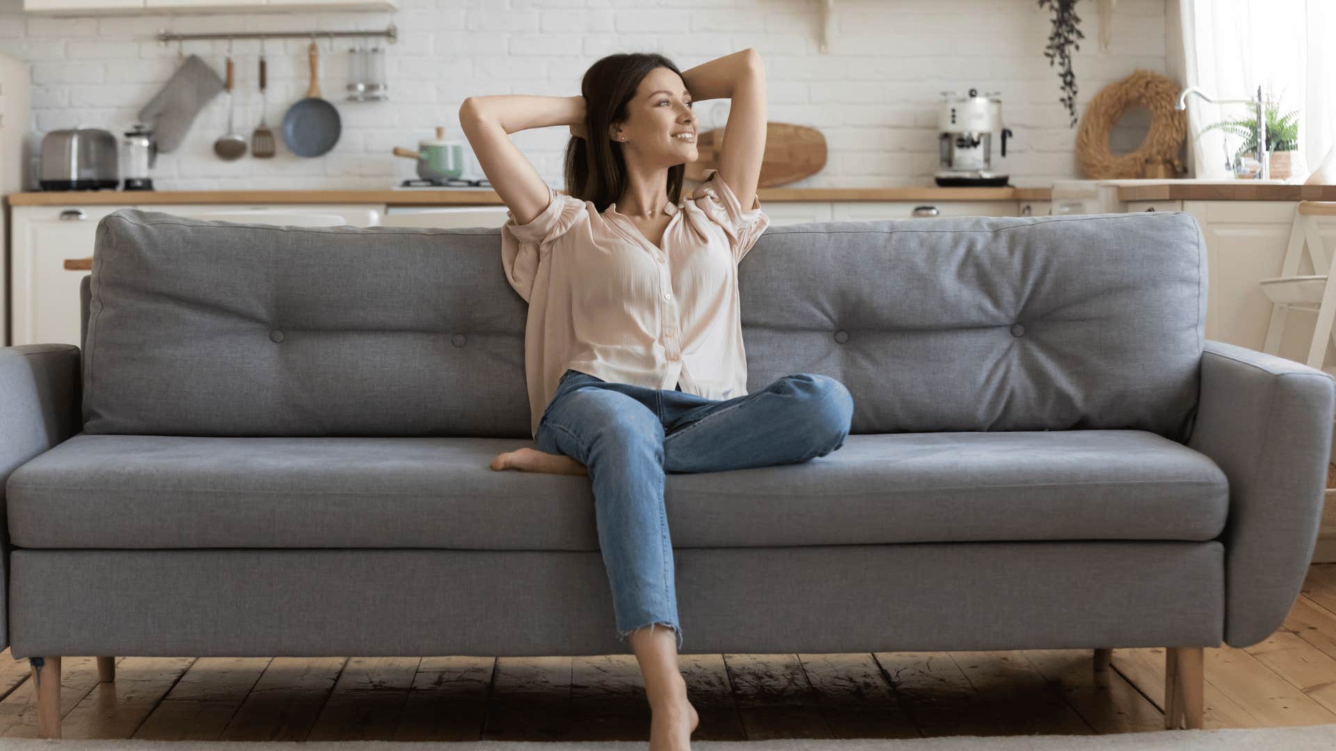 relaxed woman sitting on couch