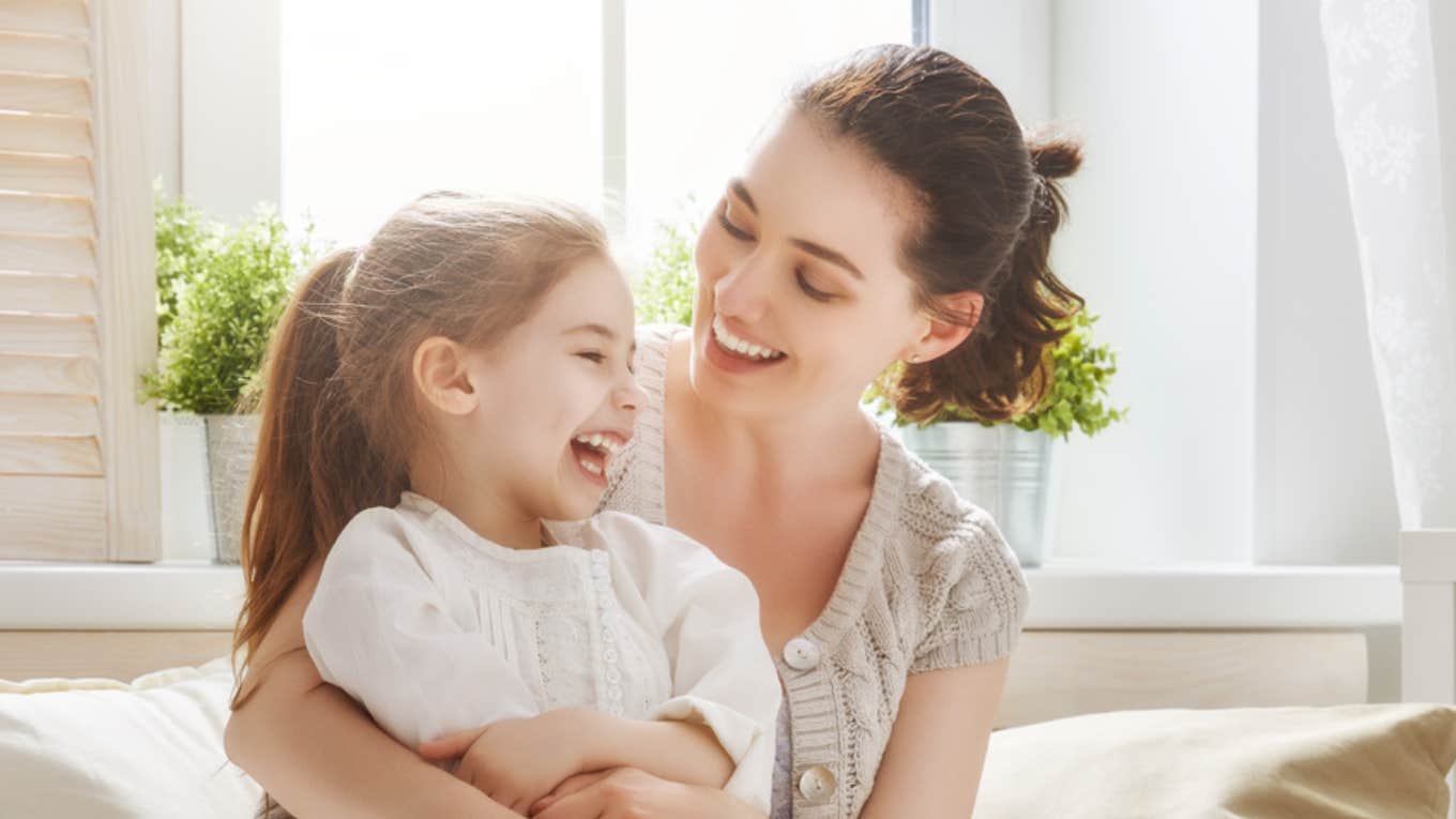 nanny and little girl laughing 