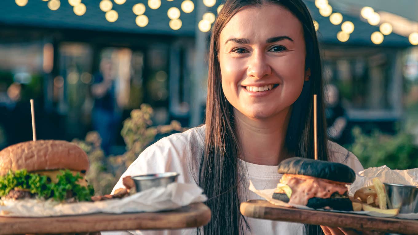 Waitress serving Ignorant Mistake burger at NJ restaurant