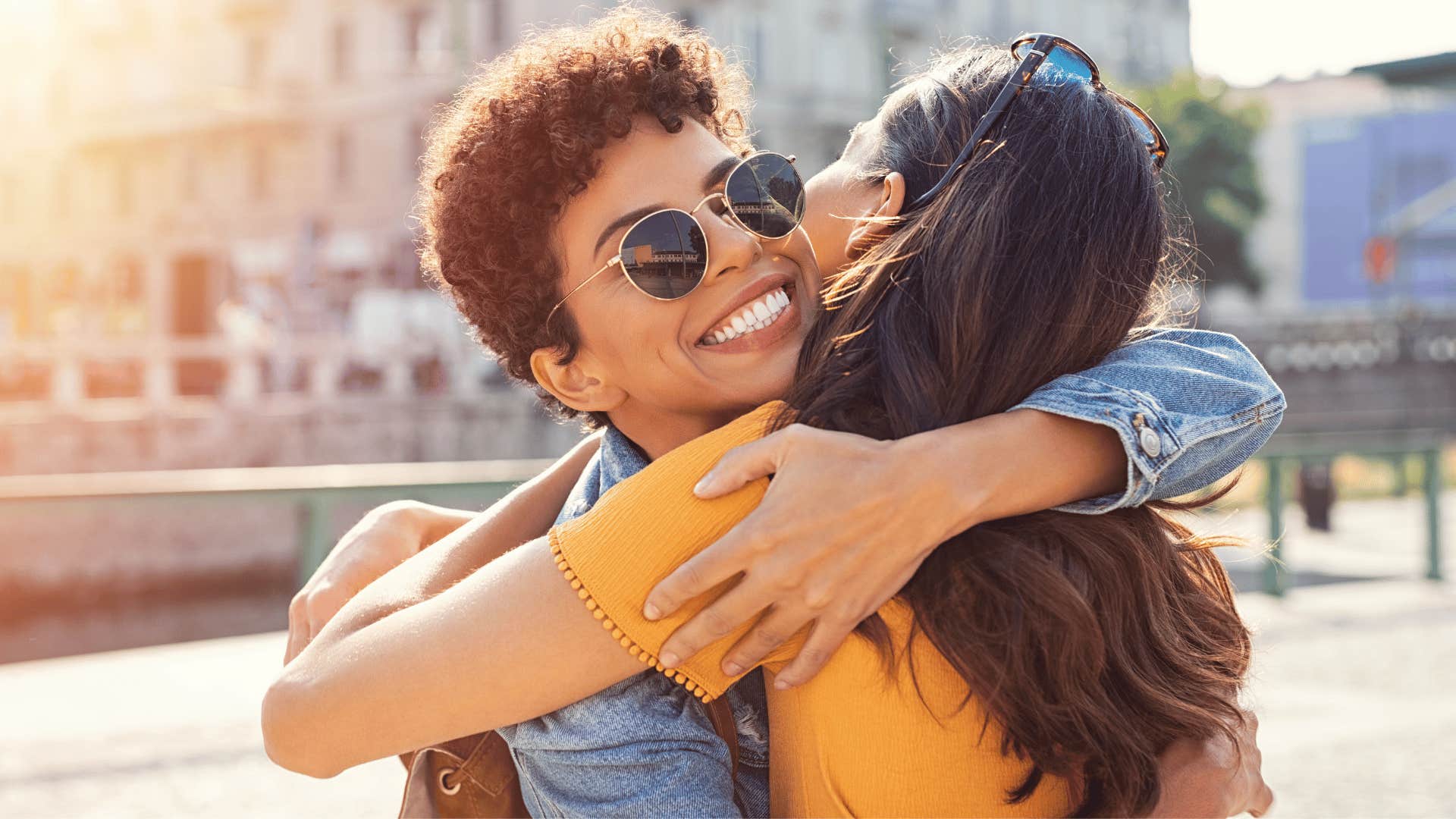 two friends hugging with reassuring touches