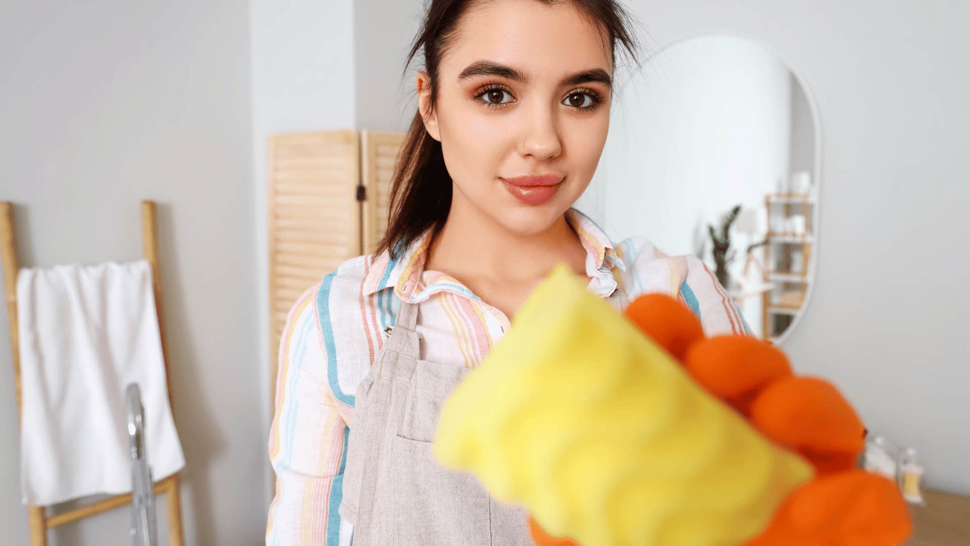 narcissistic woman sabotaging cleaning efforts in the bathroom