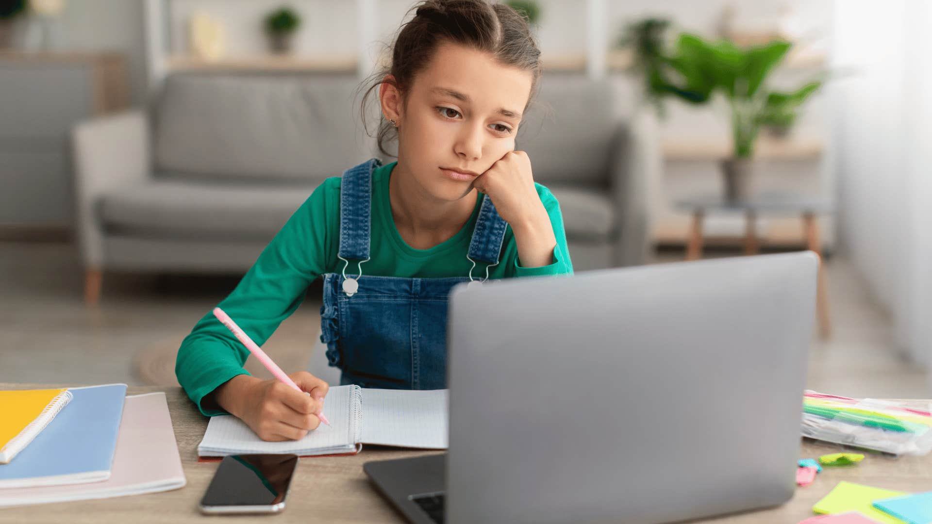 upset child at laptop