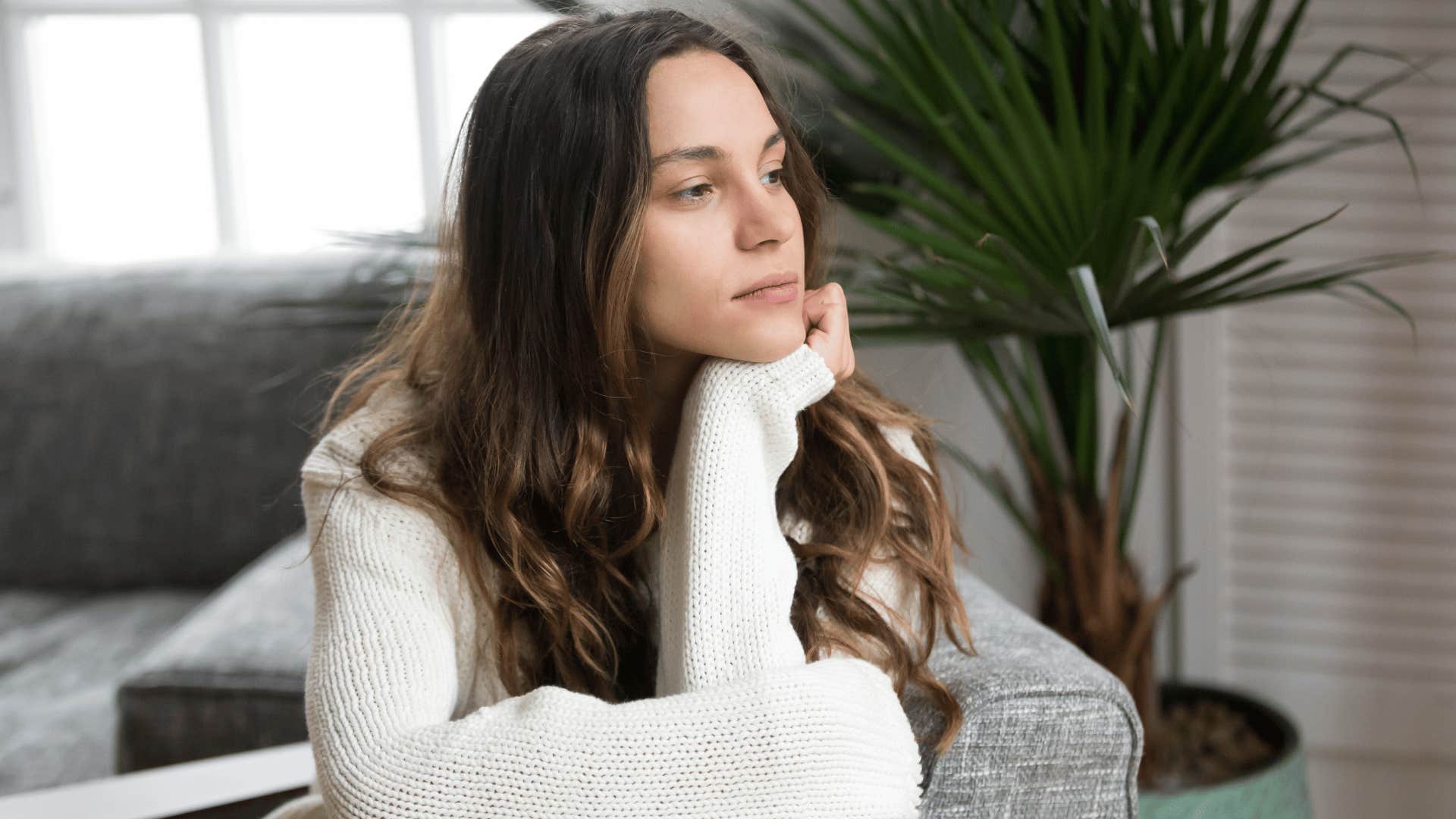 woman staring out the window