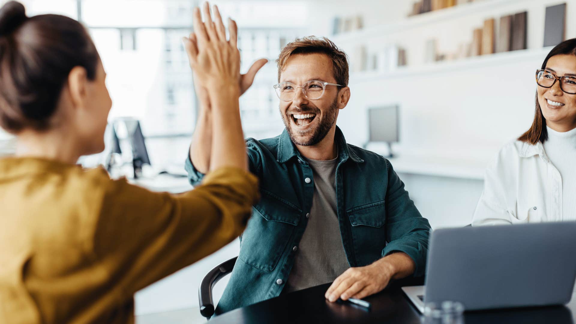 man high fiving woman