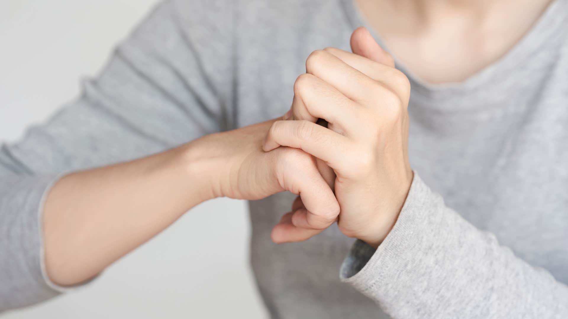 Close-up of a person cracking their knuckles