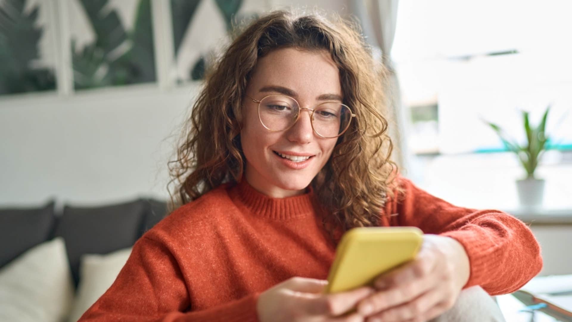 millennial woman using smartphone