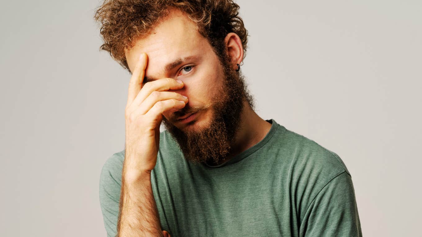 Man trying to ignore paralyzing emotion.